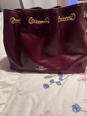 Coach Burgundy Leather Drawstring Shoulder Bag with Gold Chain Accents